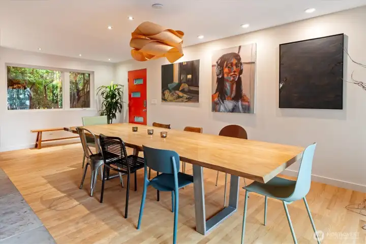 Perfect for those blustery PNW days, the huge dining room is separated from the living room by a fetching double-sided fireplace.
