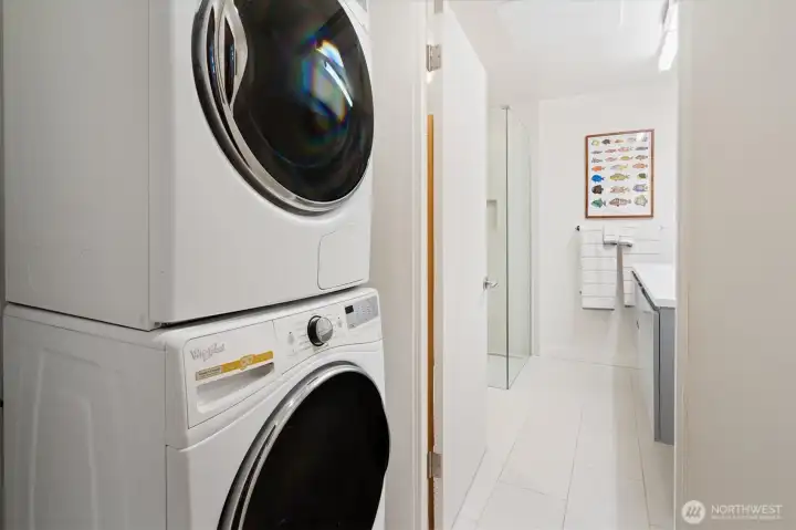 The lower level bathroom also features a second laundry room off the bathroom.