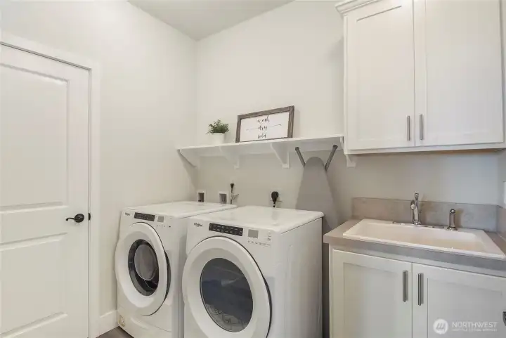 Upper floor laundry with sink