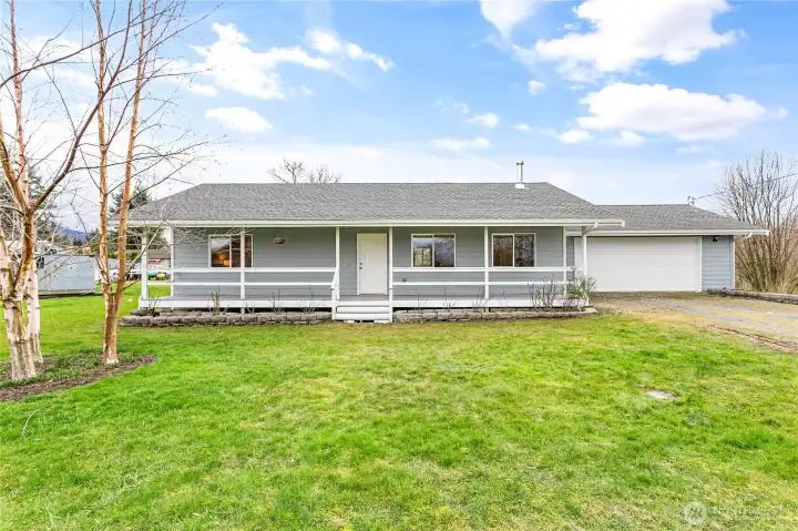 Country living charmer on .5+ acre with gardens, fruit trees & more waiting for new owners