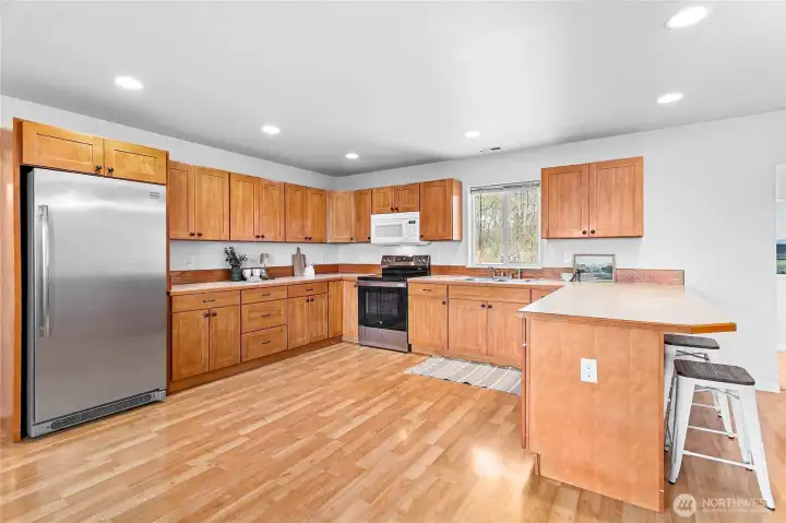 Tons of cabinets in this spacious kitchen