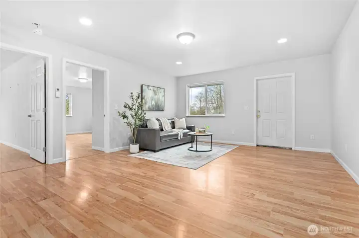 Huge family room with it's own exterior entrance in back of home. 2 more bedrooms and full size bathroom located in this half of home