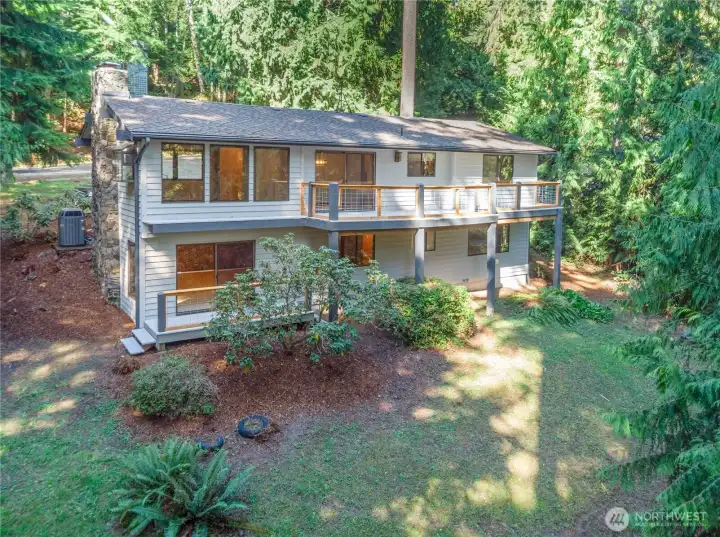 91 Drew is surrounded by beautiful cedar and fir trees, and offers 3 beds, 3 baths, two living spaces, a large garage and is located close to all the resort amenities.