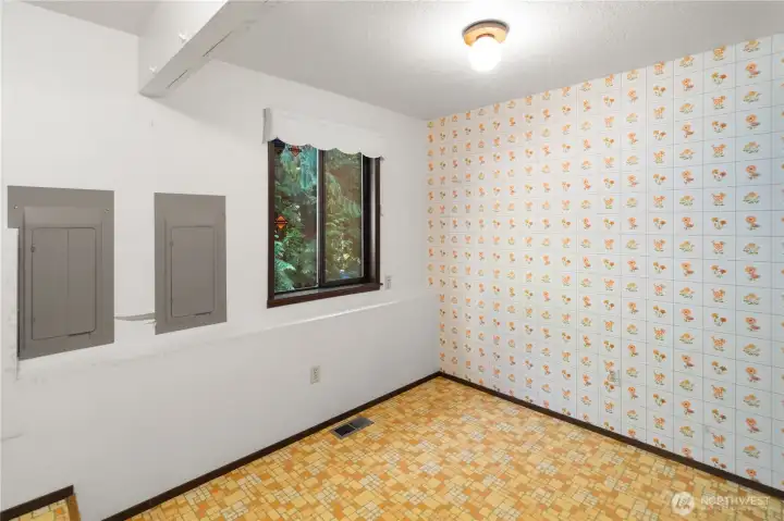 The spacious lower  level laundry room has lots of space for hobbies, storage, or whatever you need.