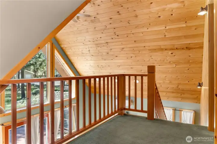Stairs leading to primary en-suite bedroom.