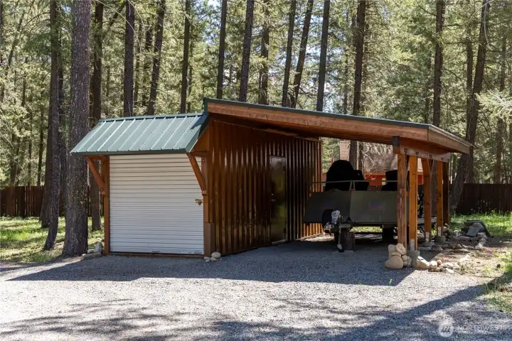 Storage container with additional carport.