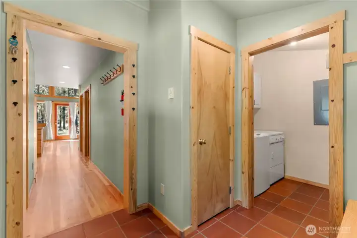 Laundry room off of mudroom. Hallway leading to living areas.