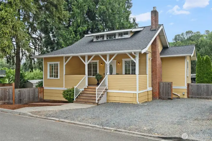Charming Craftsman character meets move-in ready appeal in this sunny yellow bungalow, complete with a welcoming covered front porch and classic architectural detailing. Fresh landscaping, wood fencing, and a low-maintenance gravel drive frame the home beautifully from the street. Don't miss the dormer window above — a signature detail that adds both light and personality to this one-of-a-kind home.
