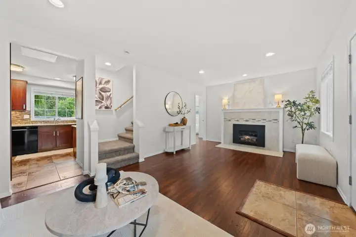 This thoughtfully connected layout offers sight lines from the living room straight through to the kitchen and dining area, making the home feel open and cohesive. Notice the staircase detail and tile fireplace surround — both add character to this move-in ready main floor.