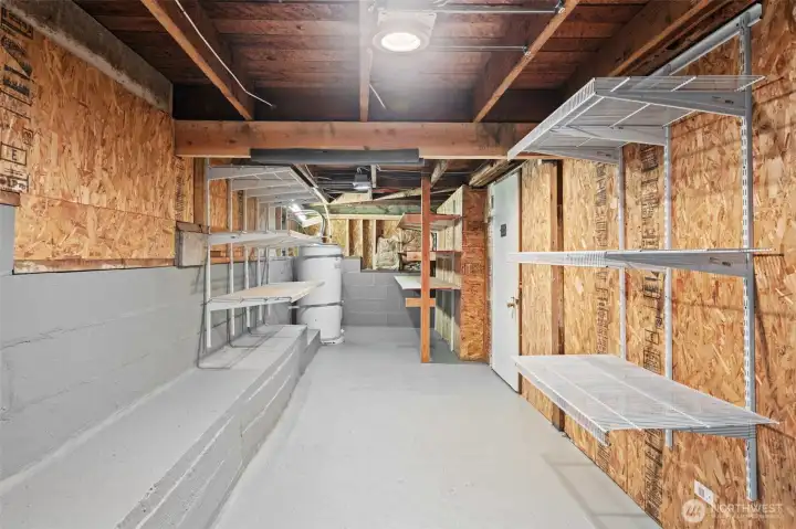 Exceptional storage room awaits in this expansive area lined with heavy-duty metal shelving and offering ample space for seasonal items, tools, and household overflow to be stored off the floor. This level of storage is a rare find and adds real everyday value to the home.
