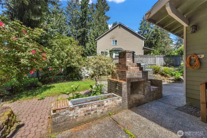Outside patio area with brick barbecue. Your looking northeast.