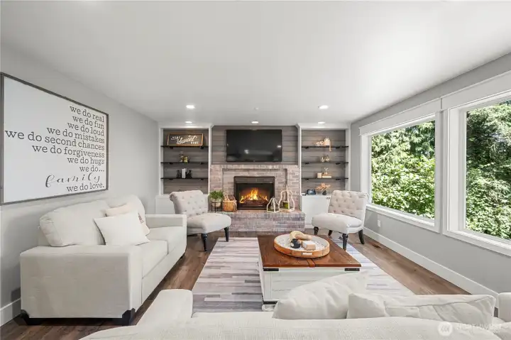 Comfort and Luxury rolled into one. The family room sits off the kitchen, hosts custom shelving for family memories, a fireplace for winter nights while overlooking the wooded back yard. Comfort and Luxury rolled into one. The family room sits off the kitchen, hosts custom shelving for family memories, a fireplace for winter nights while overlooking the wooded back yard.