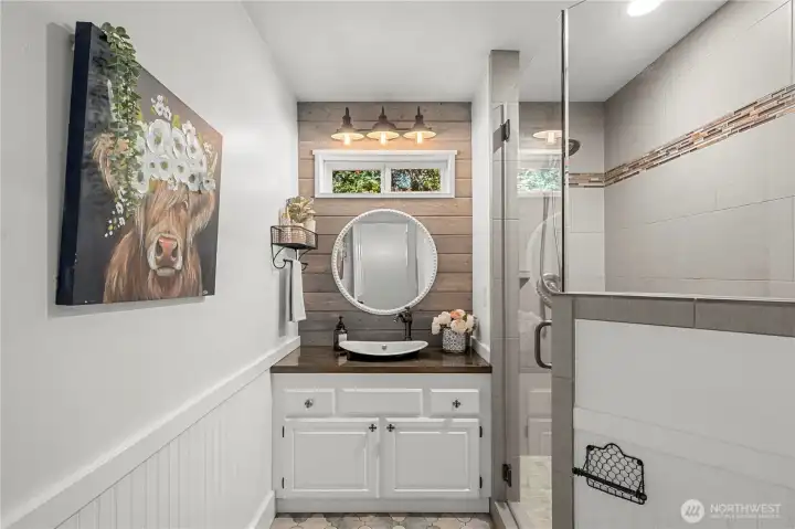 Inviting Main Level 3/4 bath w/tiled walk-in shower for your friends and overnight guests. Inviting Main Level 3/4 bath w/tiled walk-in shower for your friends and overnight guests.