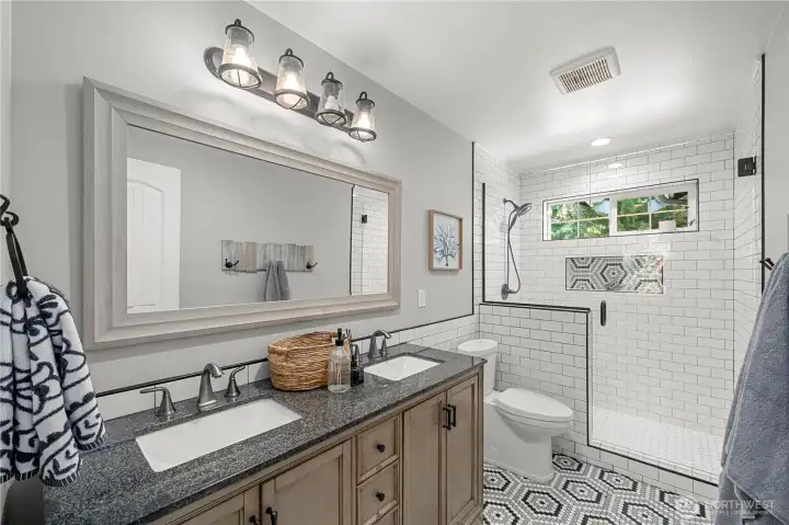 Upstairs Main Bathroom hosts a double vanity and walk-in shower. Upstairs Main Bathroom hosts a double vanity and walk-in shower.