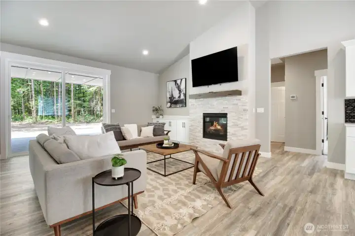 Living area is staged with plenty of room for large furniture and seating. Living area is staged with plenty of room for large furniture and seating.