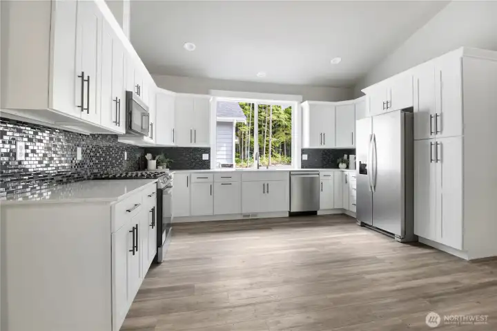This kitchen has it all! Even space for your own custom island if you really wanted one. This kitchen has it all! Even space for your own custom island if you really wanted one.