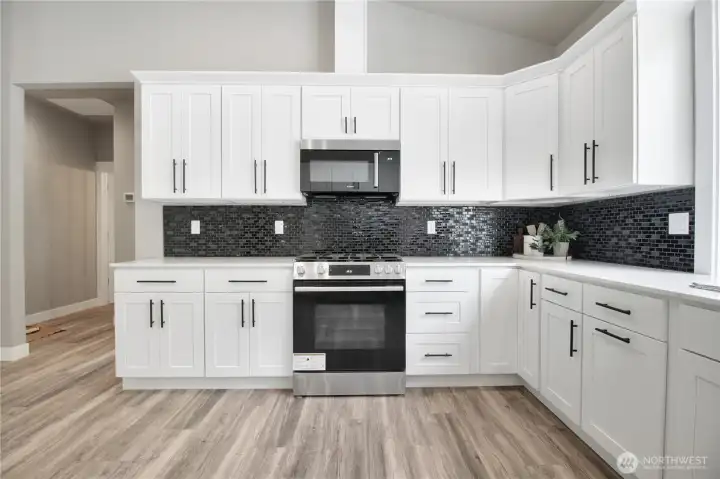sleek black tile with white high-end cabinets could be styled and decorated with any aesthetic sleek black tile with white high-end cabinets could be styled and decorated with any aesthetic