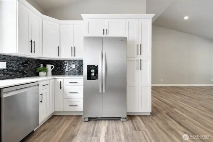 Pantry cupboard and oversized refrigerator take care of your storage needs. Pantry cupboard and oversized refrigerator take care of your storage needs.