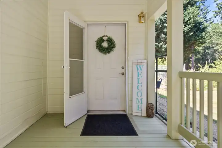 Welcome home! Covered entry with screen door.