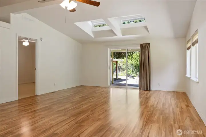 Great room with skylights and a slider to take you to the patio.