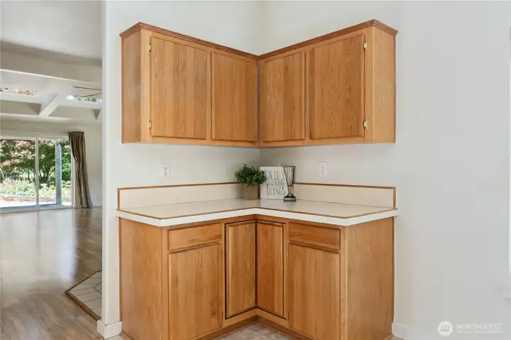 Cabinets next to the kitchen nook.
