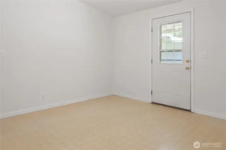 Bedroom 1 has a door that leads to the backyard.