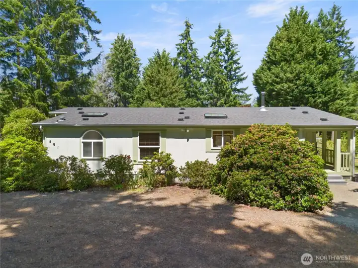 Welcome home - circle driveway and ample parking.