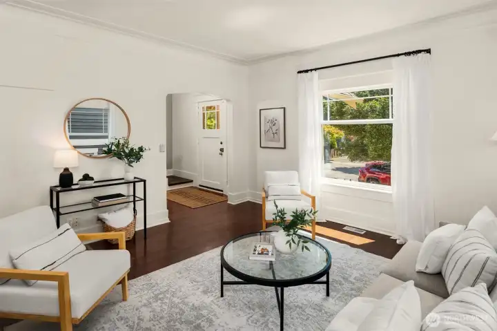 Tons of natural light via the south and west-facing living room windows. Tons of natural light via the south and west-facing living room windows.