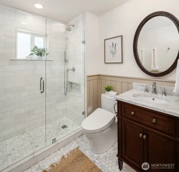 Beautifully renovated 2nd floor bathroom with radiant heated floors, marble tile and under-cabinet lighting. Beautifully renovated 2nd floor bathroom with radiant heated floors, marble tile and under-cabinet lighting.