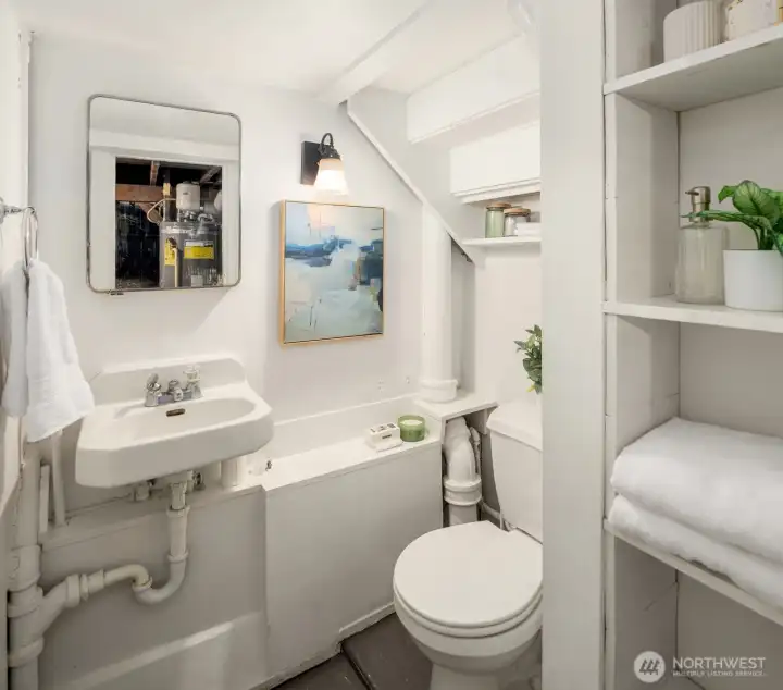 Lower-level half bathroom. Lower-level half bathroom.