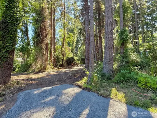 Driveway stubbed into lot along with water, sewer, and fiber conduit. Power is at the beginning of the driveway.