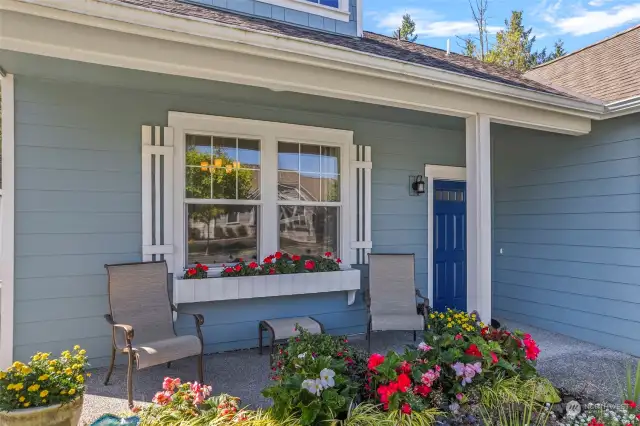 Gorgeous flowers surround this home