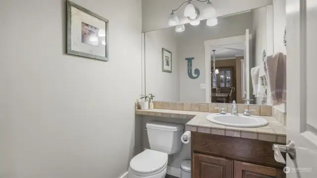 A stylish bathroom featuring a spacious vanity and a large mirror, perfect for daily routines.