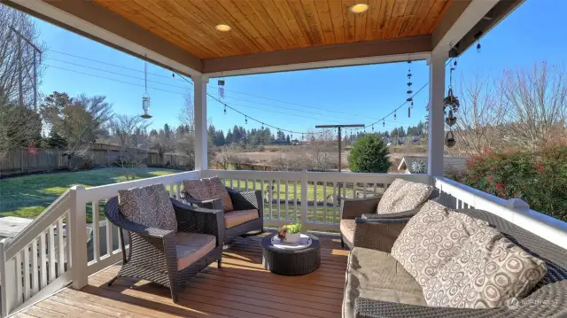 A cozy patio or deck seating area, ideal for relaxing and enjoying the fresh air.