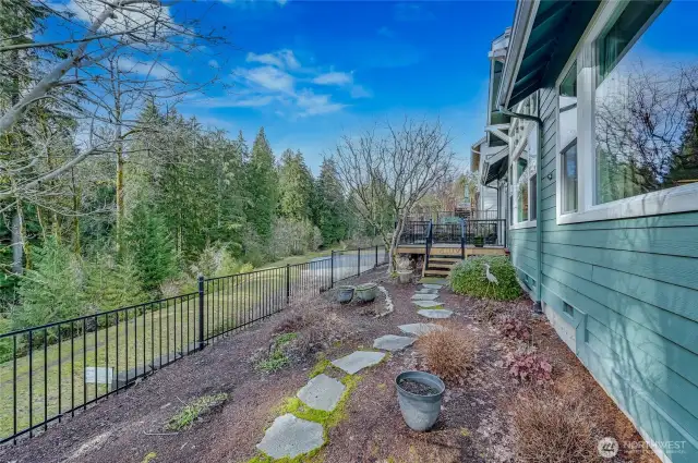 Looking out from the backyard to the greenspace and pond.