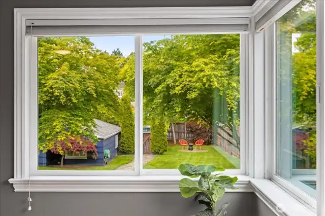 Wake up to lush green scenery and a peek into the private backyard oasis.