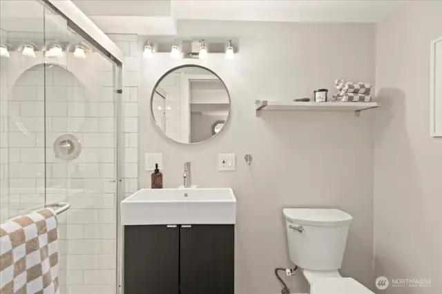 An updated powder room adjacent to the office makes this lower level ideal for long workdays or visiting guests.