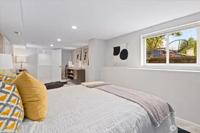 Bright and surprisingly spacious, this downstairs bedroom easily accommodates a full furniture setup with room to spare.