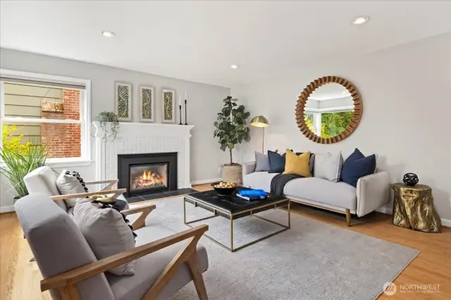 Ample windows and warm wood floors create a perfect setting for everyday living or entertaining.