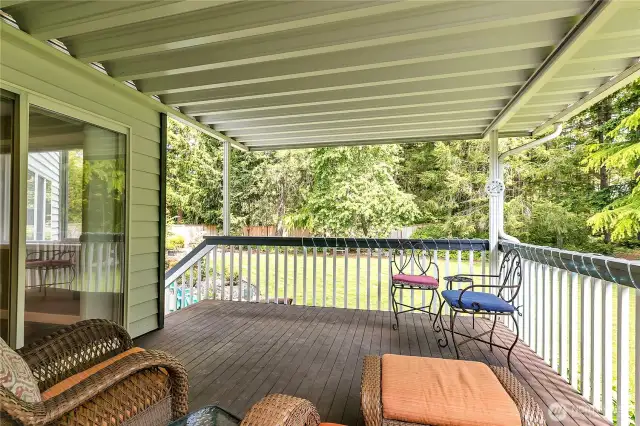 The covered deck extends your outdoor living and leads to the backyard.