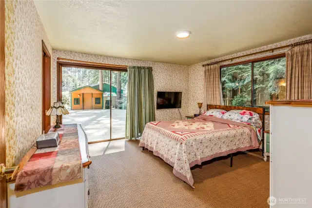 Primary bedroom with slider to patio