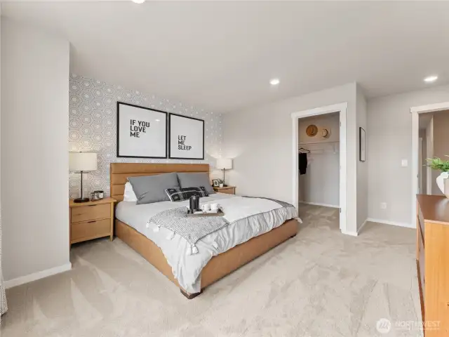 Alternate angle reveals generous sleeping area, bedside lighting, and direct access to the oversized walk-in closet. Pictures are for representational purposes only, colors and features may vary.