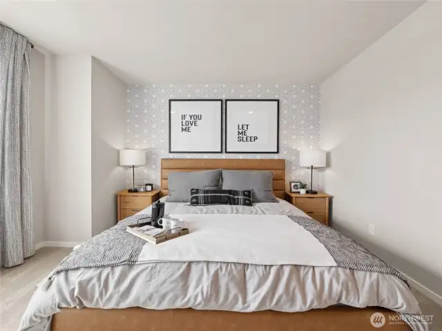 Close-up of owner’s retreat highlights geometric accent wallpaper, padded headboard and matching lamps for boutique-hotel style comfort. Pictures are for representational purposes only, colors and features may vary.