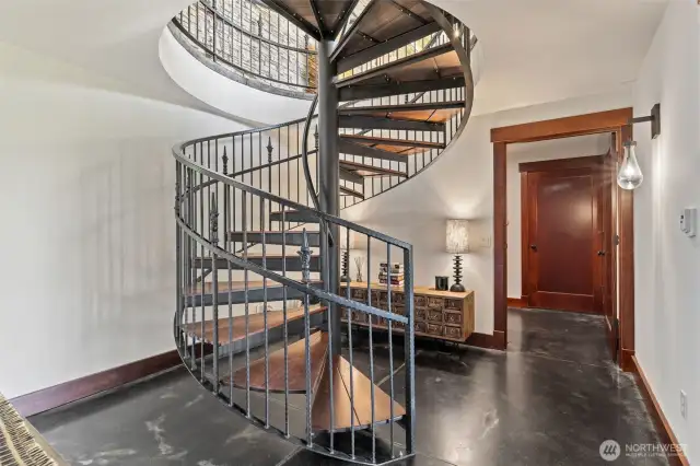 Interior spiral stairway and concrete floors. Very custom and beautiful!