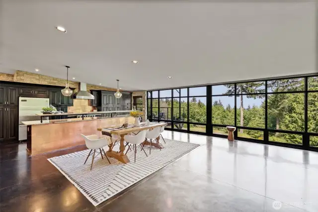 Dining & kitchen w/breakfast bar. Lots of windows and light.