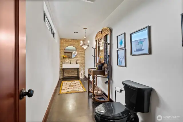Large powder room behind the kitchen area