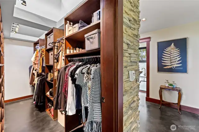 Lg walk-in closet with custom built-in organizers.
