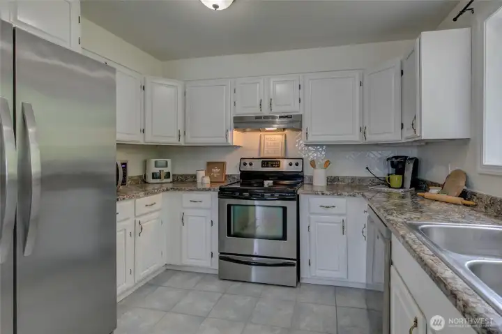 Kitchen area. Lots of cupboards and space.  Ready for you!