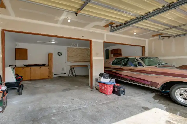 Picture of the large 2 car garage with a work area.