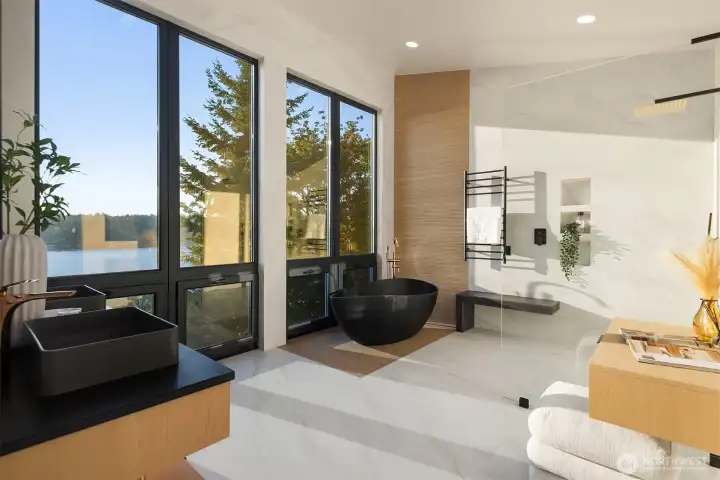 Spa-inspired bath – Freestanding tub, designer finishes, and endless views.